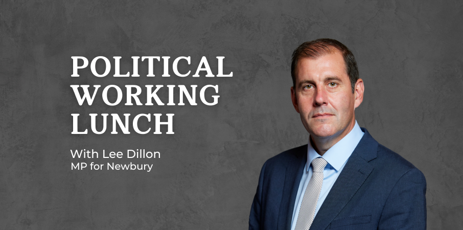 Banner for 'Political Working Lunch' featuring a man in a blue suit on a dark background.