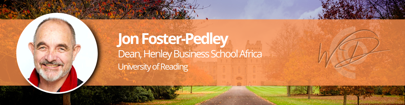 Banner with Jon Foster-Pedley portrait on the left and orange overlay text: 'Jon Foster-Pedley, Dean, Henley Business School Africa, University of Reading' across the center, plus a WD logo on the right over a campus with autumn trees and a path in the background.