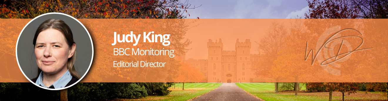 Judy King—BBC Monitoring Editorial Director portrait on an orange banner with autumn park and castle backdrop.