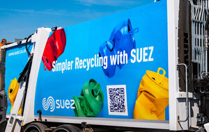 Advertising panel on a recycling truck reading 'Simpler Recycling with SUEZ' with colored recycling bags and a QR code nearby.