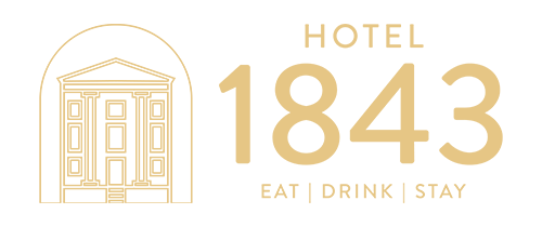 Hotel 1843 logo: a line-drawn building icon on the left and gold text reading HOTEL 1843 EAT | DRINK | STAY.