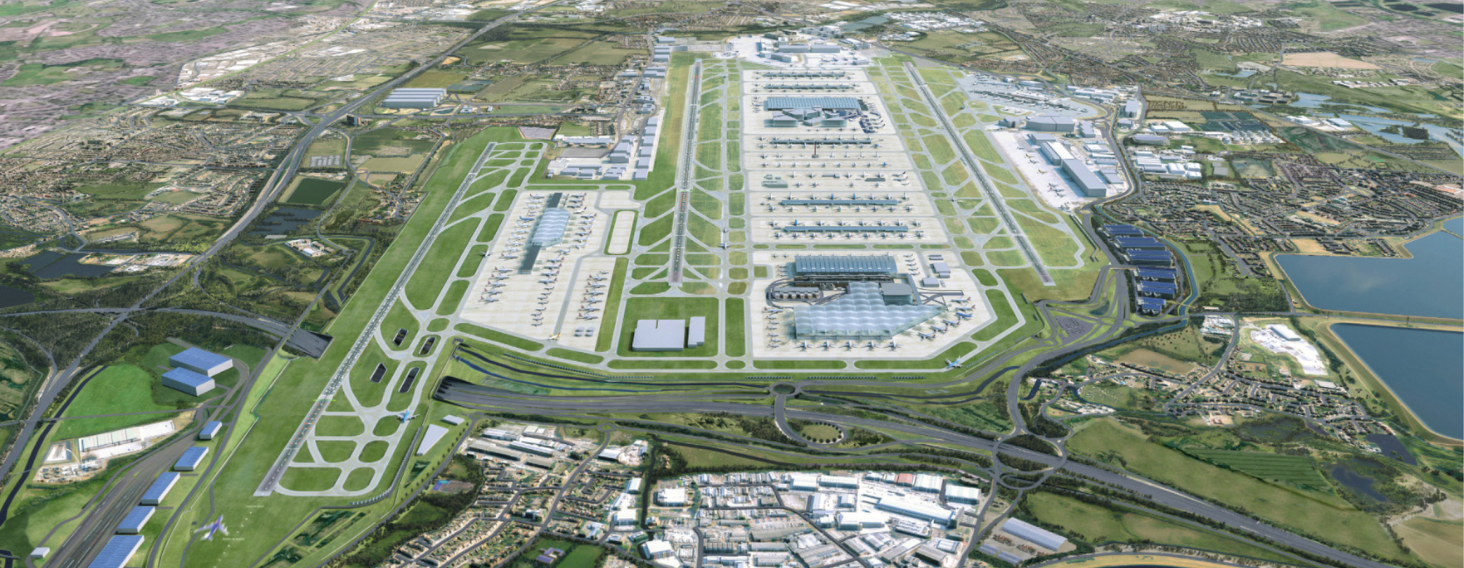 NEW - News item size 81 | Thames Valley Chamber of Commerce Aerial view of a large international airport with parallel runways, multiple terminal buildings, and aircraft parked at gates.