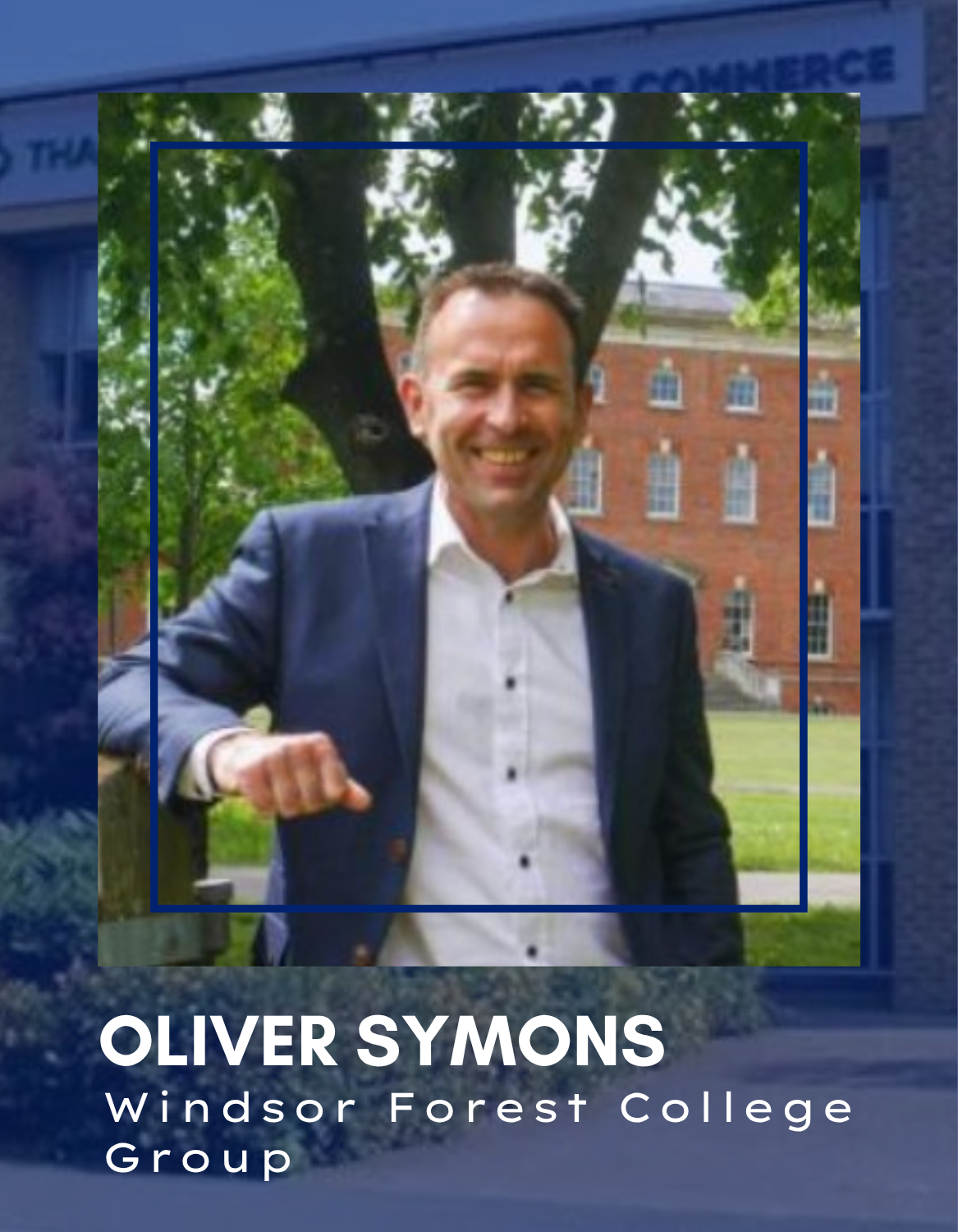 Oliver Symons | Thames Valley Chamber of Commerce Portrait of Oliver Symons in a navy blazer, smiling outdoors on a campus with a brick building and trees; overlay text shows his name