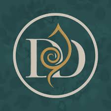 Circular teal logo with intertwined letters J and D and a gold spiral at the center.