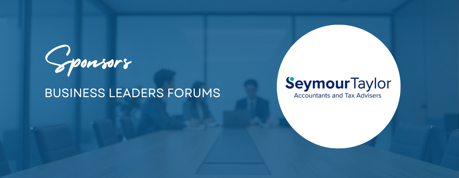 Sponsor banner for Business Leaders Forums featuring Seymour Taylor logo on a blue conference-room backdrop.